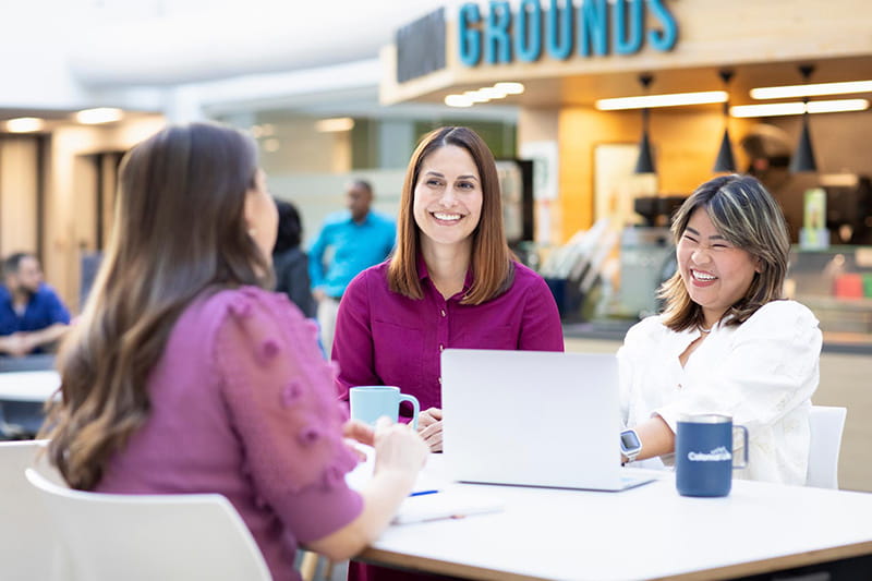 Group of employees sitting at a table