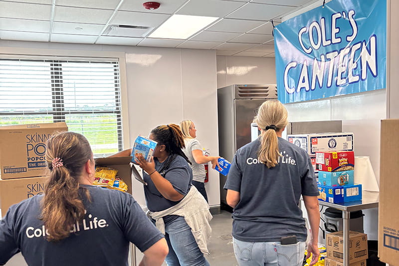 Unum Group volunteers working at Camp Cole
