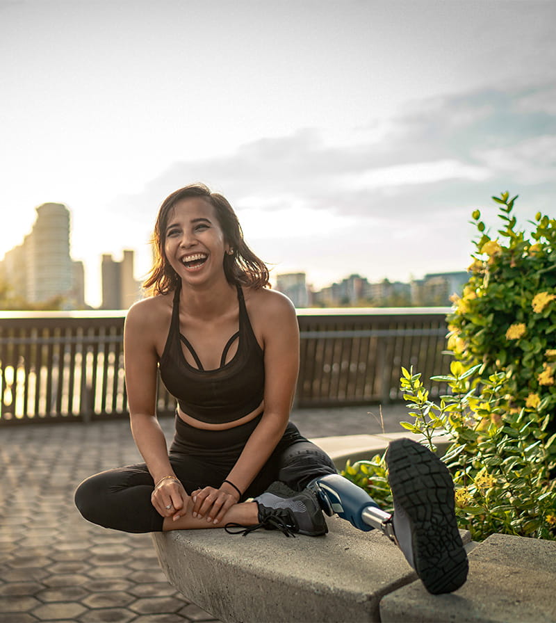 Person with a prosthetic leg stretching before a run